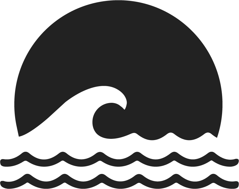 Silhouette of a wave crashing in the ocean with a setting sun in the background.